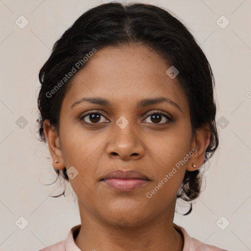 Joyful black young-adult female with medium  brown hair and brown eyes