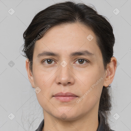 Joyful white adult female with medium  brown hair and brown eyes