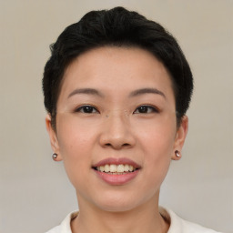 Joyful asian young-adult female with short  black hair and brown eyes