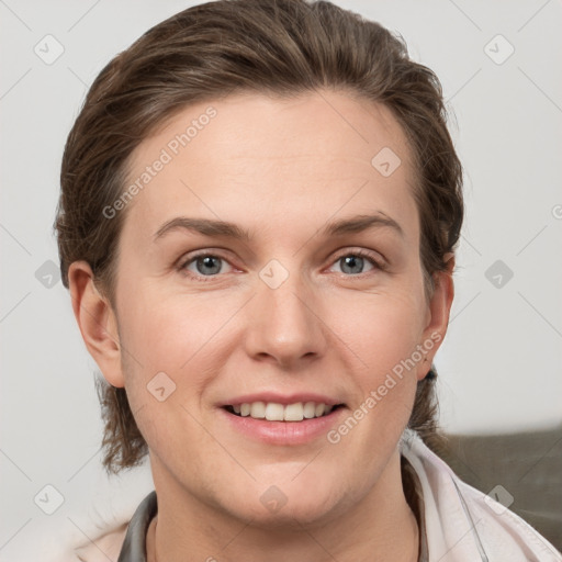 Joyful white young-adult female with medium  brown hair and grey eyes