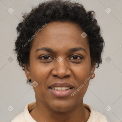 Joyful black adult female with short  brown hair and brown eyes