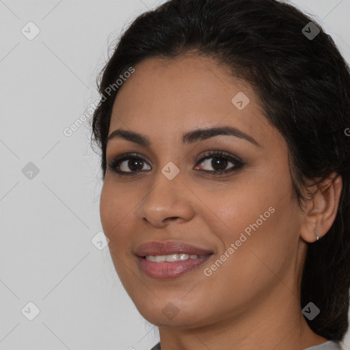 Joyful latino young-adult female with long  brown hair and brown eyes