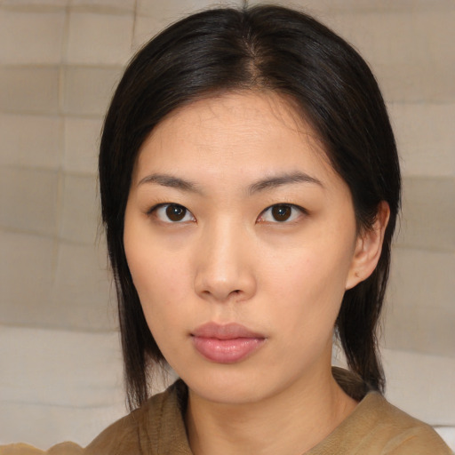 Neutral asian young-adult female with medium  brown hair and brown eyes