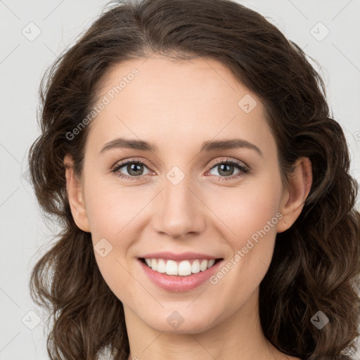 Joyful white young-adult female with long  brown hair and green eyes