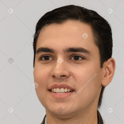 Joyful white young-adult male with short  black hair and brown eyes