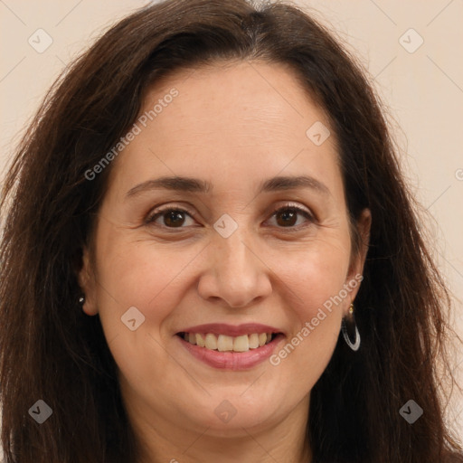 Joyful white adult female with long  brown hair and brown eyes