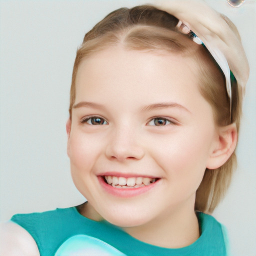 Joyful white child female with short  brown hair and brown eyes