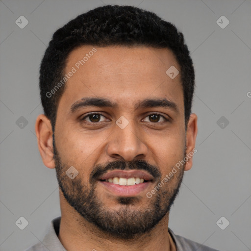 Joyful black young-adult male with short  black hair and brown eyes