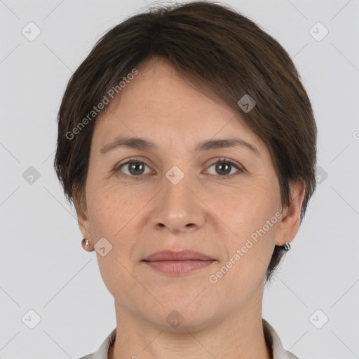 Joyful white adult female with short  brown hair and brown eyes