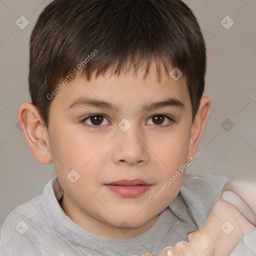 Joyful white child male with short  brown hair and brown eyes