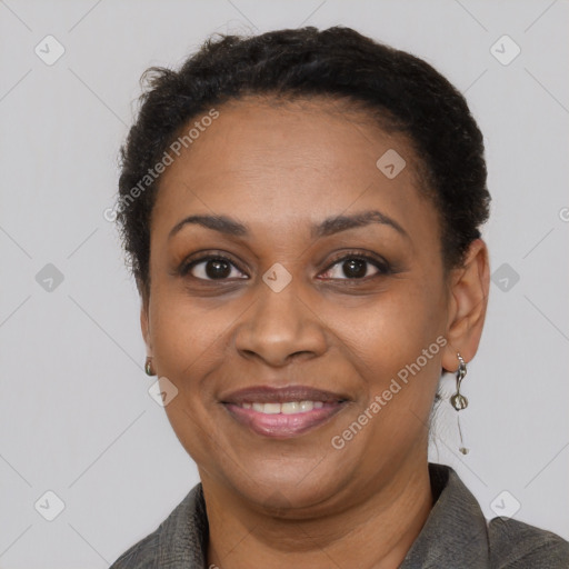 Joyful black adult female with short  brown hair and brown eyes