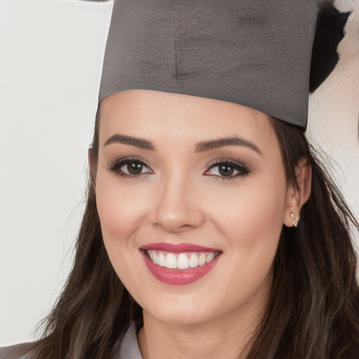 Joyful white young-adult female with long  black hair and brown eyes