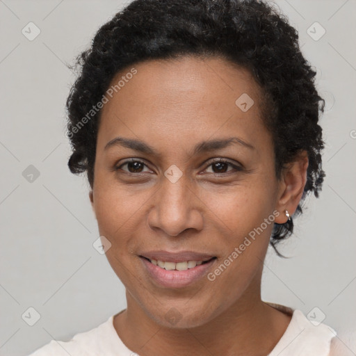 Joyful black adult female with short  brown hair and brown eyes