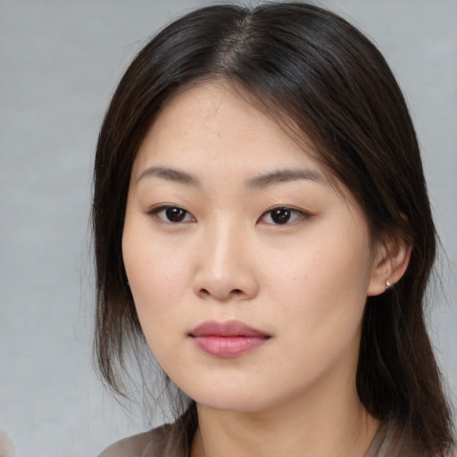 Neutral asian young-adult female with medium  brown hair and brown eyes