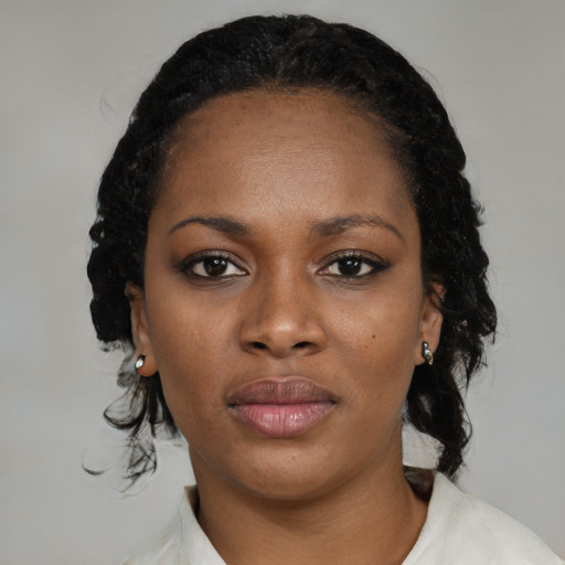 Neutral black young-adult female with medium  black hair and brown eyes
