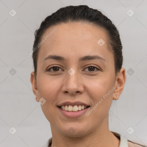 Joyful white young-adult female with short  brown hair and brown eyes