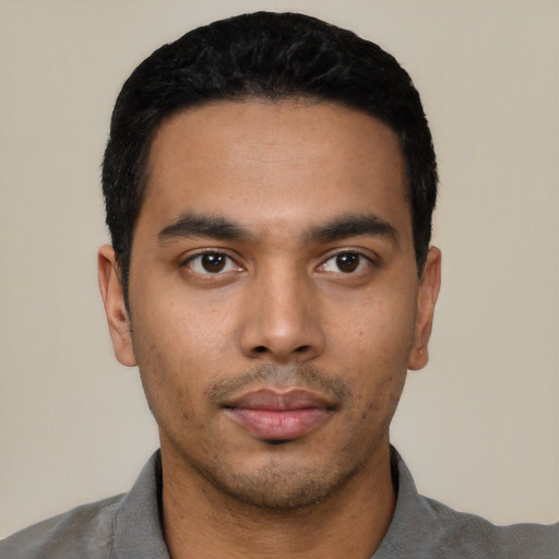 Neutral latino young-adult male with short  black hair and brown eyes