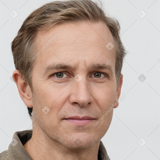 Joyful white adult male with short  brown hair and grey eyes