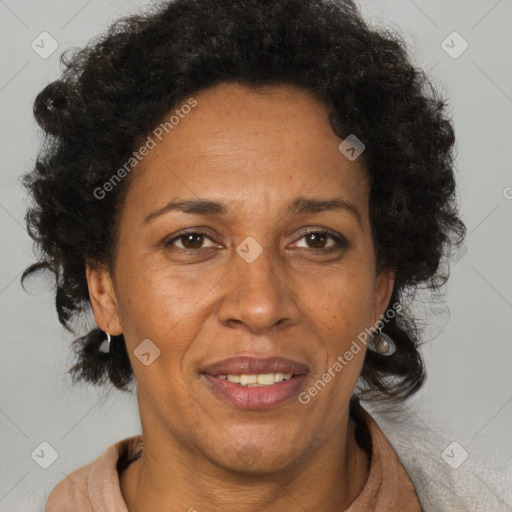 Joyful black adult female with short  brown hair and brown eyes