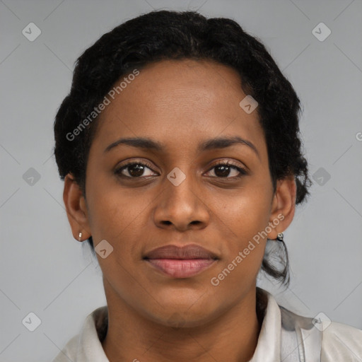 Joyful black young-adult female with short  black hair and brown eyes