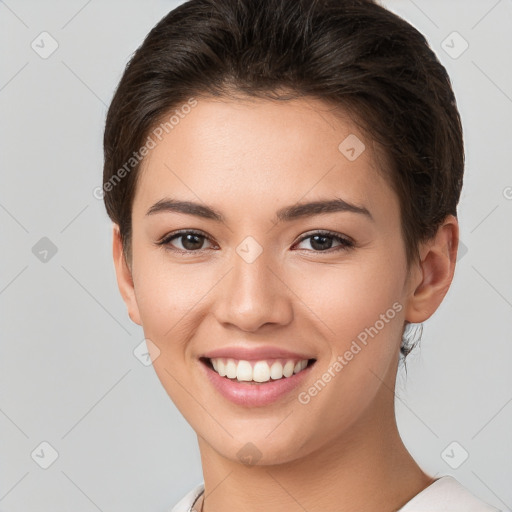 Joyful white young-adult female with short  brown hair and brown eyes