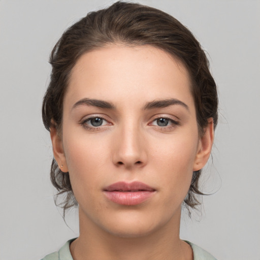 Neutral white young-adult female with medium  brown hair and brown eyes