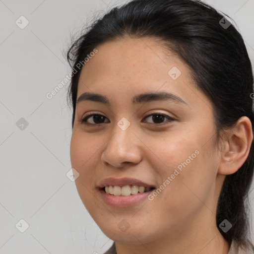 Joyful latino young-adult female with long  brown hair and brown eyes