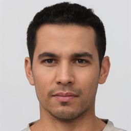 Neutral white young-adult male with short  black hair and brown eyes
