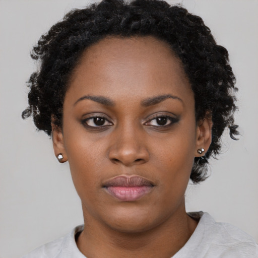 Neutral latino young-adult female with short  black hair and brown eyes