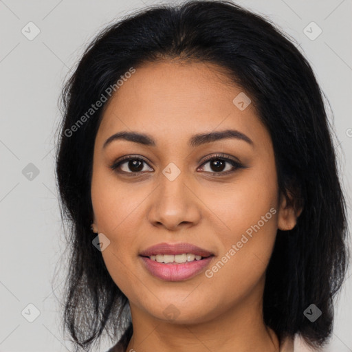 Joyful latino young-adult female with long  brown hair and brown eyes