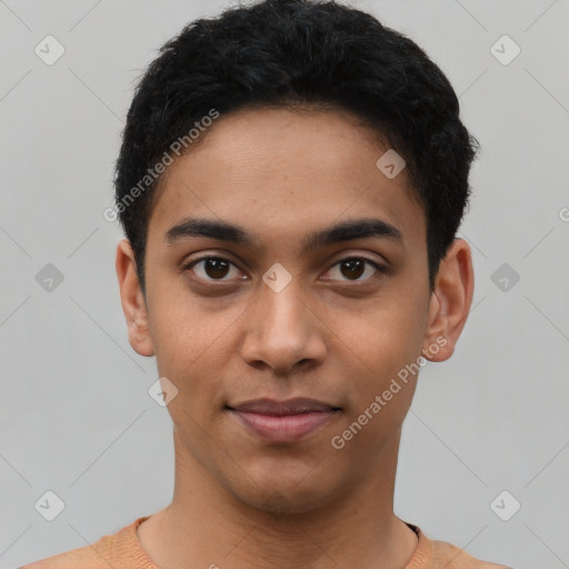 Joyful latino young-adult male with short  black hair and brown eyes