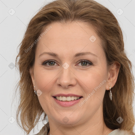 Joyful white adult female with medium  brown hair and grey eyes