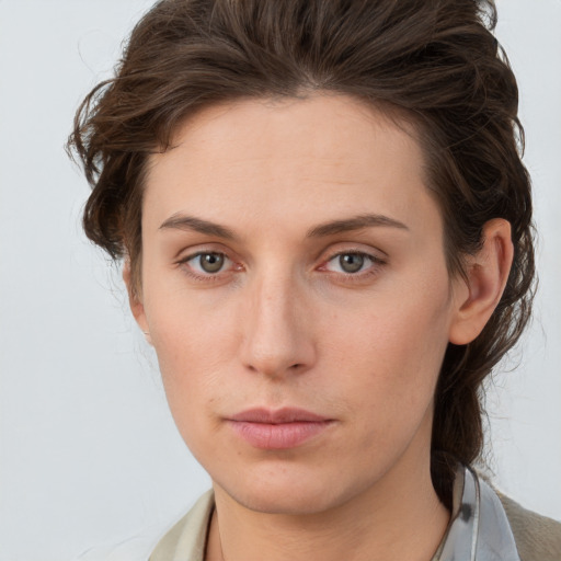 Neutral white young-adult female with medium  brown hair and grey eyes