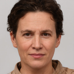 Joyful white adult female with short  brown hair and brown eyes