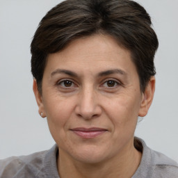 Joyful white adult female with short  brown hair and brown eyes