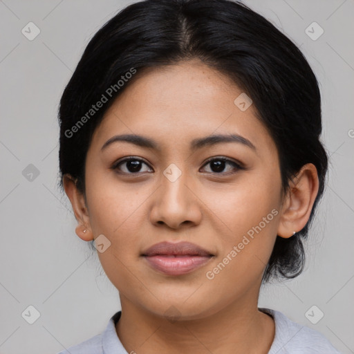 Joyful latino young-adult female with medium  black hair and brown eyes