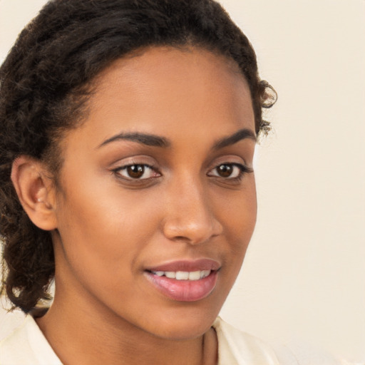 Joyful latino young-adult female with short  brown hair and brown eyes