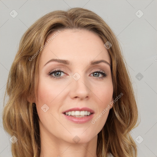 Joyful white young-adult female with long  brown hair and green eyes