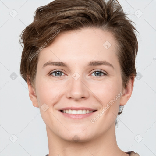 Joyful white young-adult female with short  brown hair and grey eyes