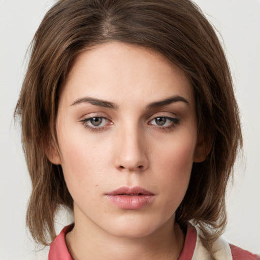 Neutral white young-adult female with medium  brown hair and grey eyes