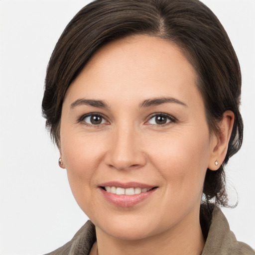 Joyful white young-adult female with medium  brown hair and brown eyes