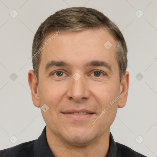 Joyful white adult male with short  brown hair and brown eyes