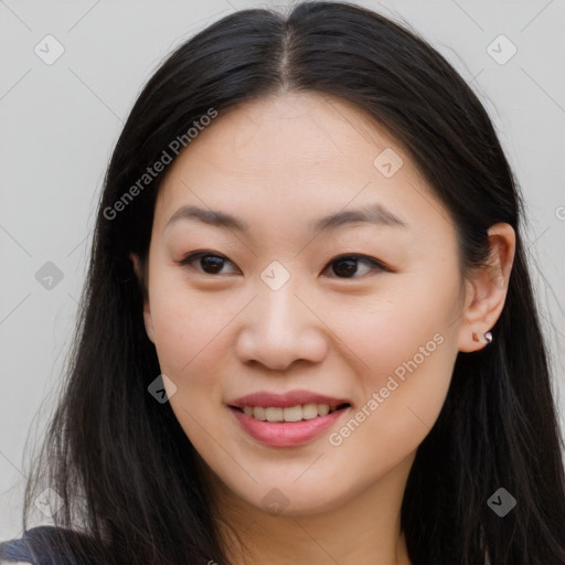 Joyful asian young-adult female with long  brown hair and brown eyes