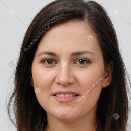 Joyful white young-adult female with long  brown hair and brown eyes