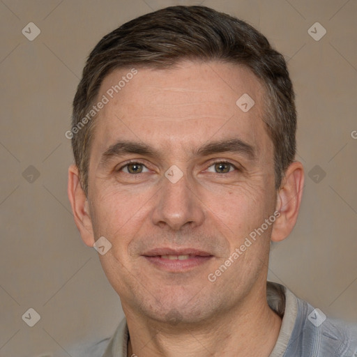 Joyful white adult male with short  brown hair and brown eyes