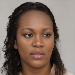 Neutral black young-adult female with long  brown hair and brown eyes