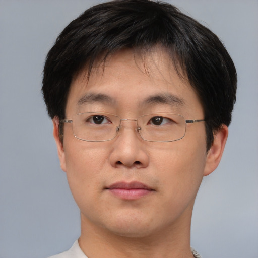 Neutral asian adult male with short  brown hair and brown eyes