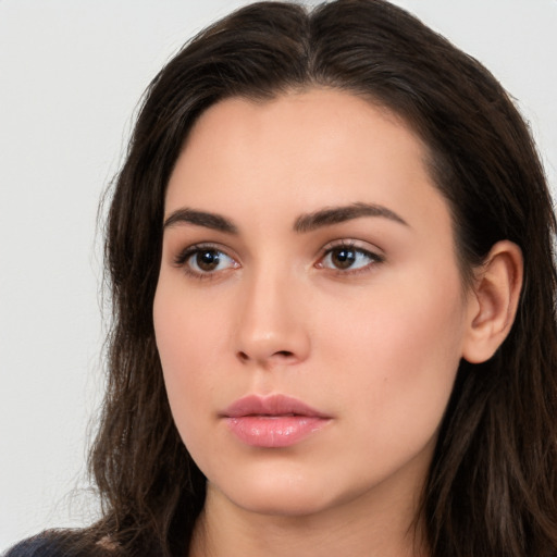 Neutral white young-adult female with long  brown hair and brown eyes