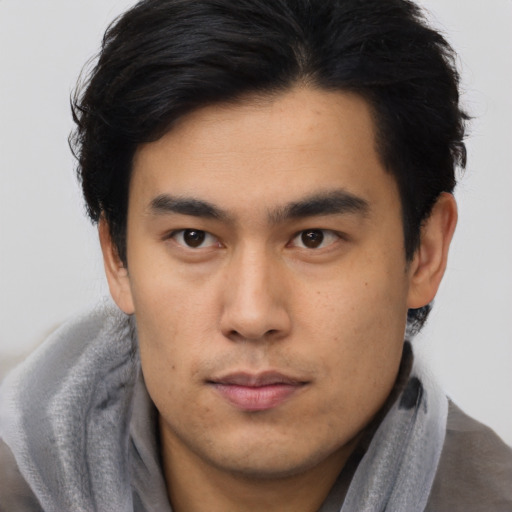 Neutral asian young-adult male with short  brown hair and brown eyes
