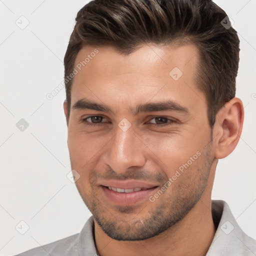 Joyful white young-adult male with short  brown hair and brown eyes